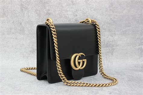 mini gucci purse black with gold black carry strap|Gucci small purse sale.